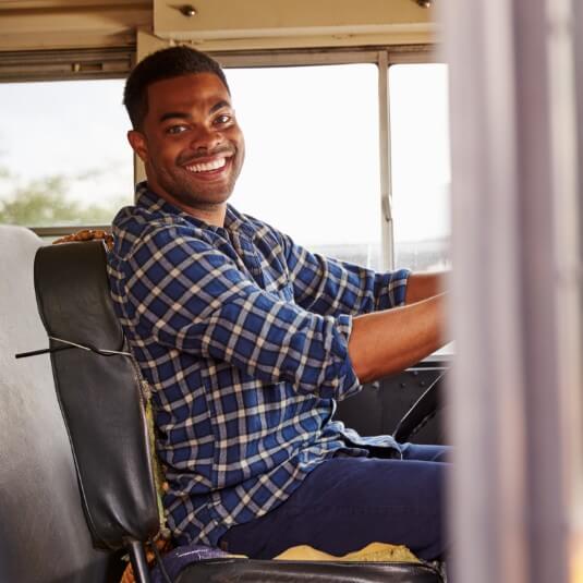 man driving school bus