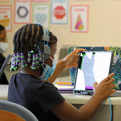 elementary student using a tablet