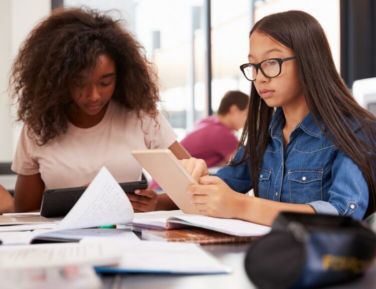 middle school aged students studying