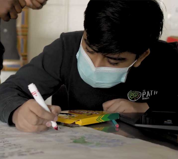 child coloring with markers