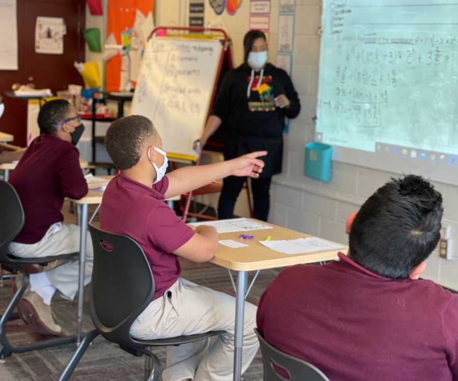 young men sitting in classroom