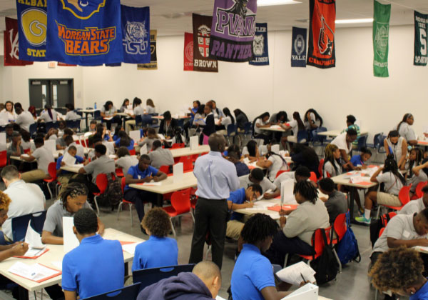 teacher speaking to classroom full of students